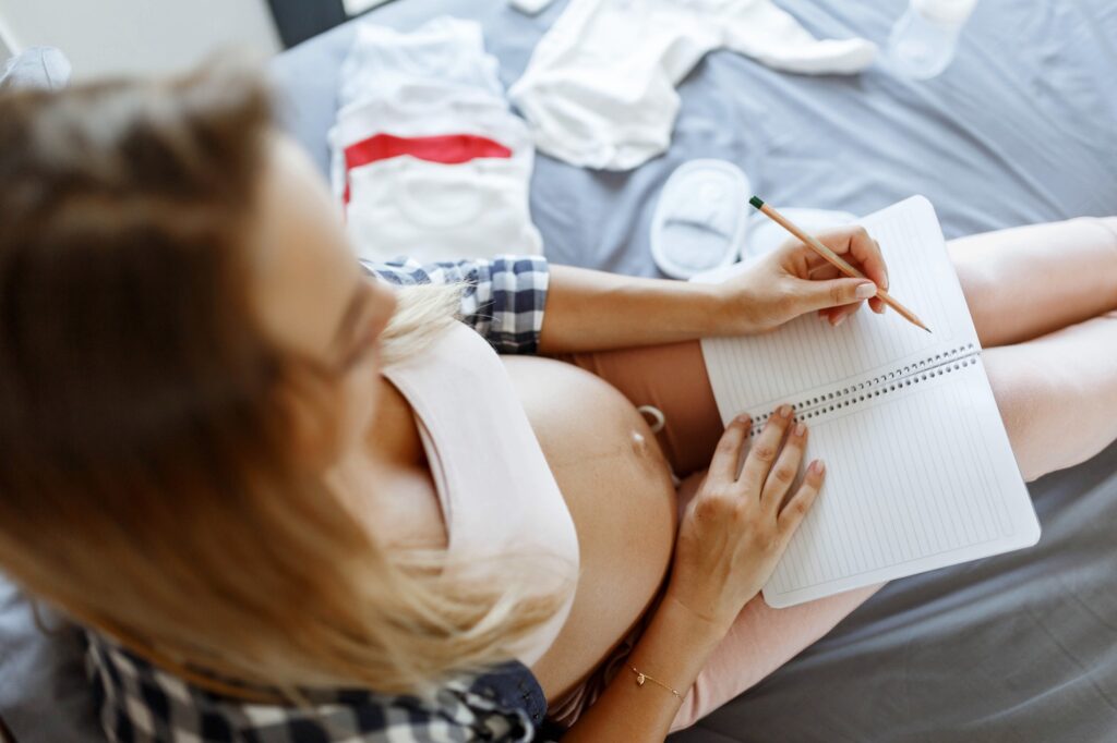 pregnant woman making list